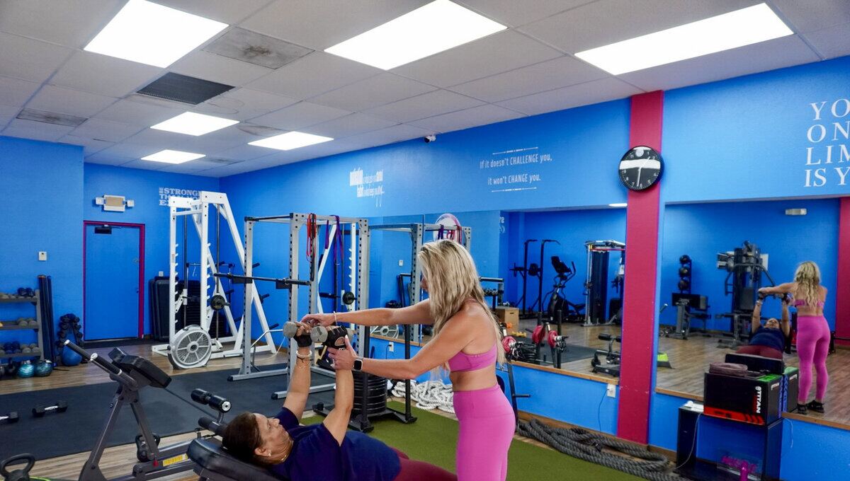 An older member being coached at Barbelles